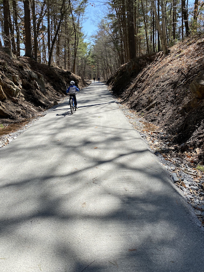 Boy riding the new rail trail